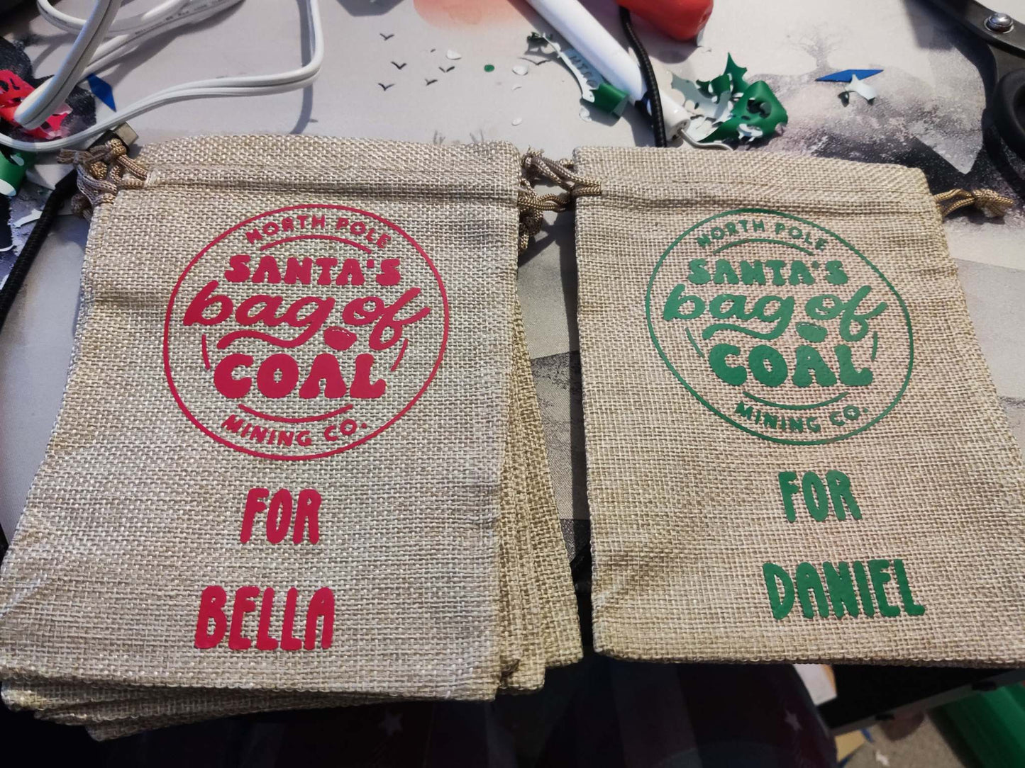 Personalized "Bag of Coal" hessian sacks with names, humorous Christmas gift.