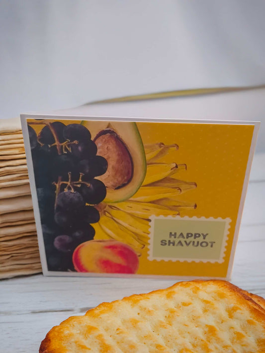 Vibrant Shavuot card with fruit theme and "Happy Shavuot" message.